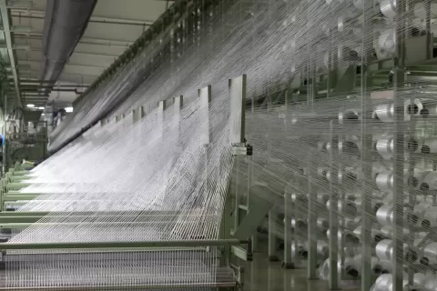 Airbag webbing and weaving