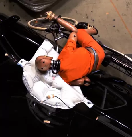 Car-Based External Airbag for Bicyclist Protection in Side Impacts