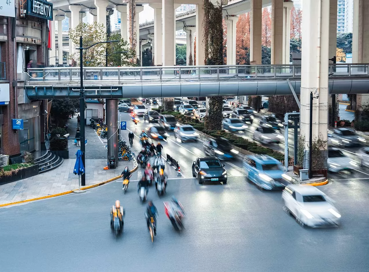Busy street with cars and bikes
